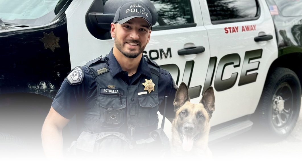 a police man w/ a k9 dog