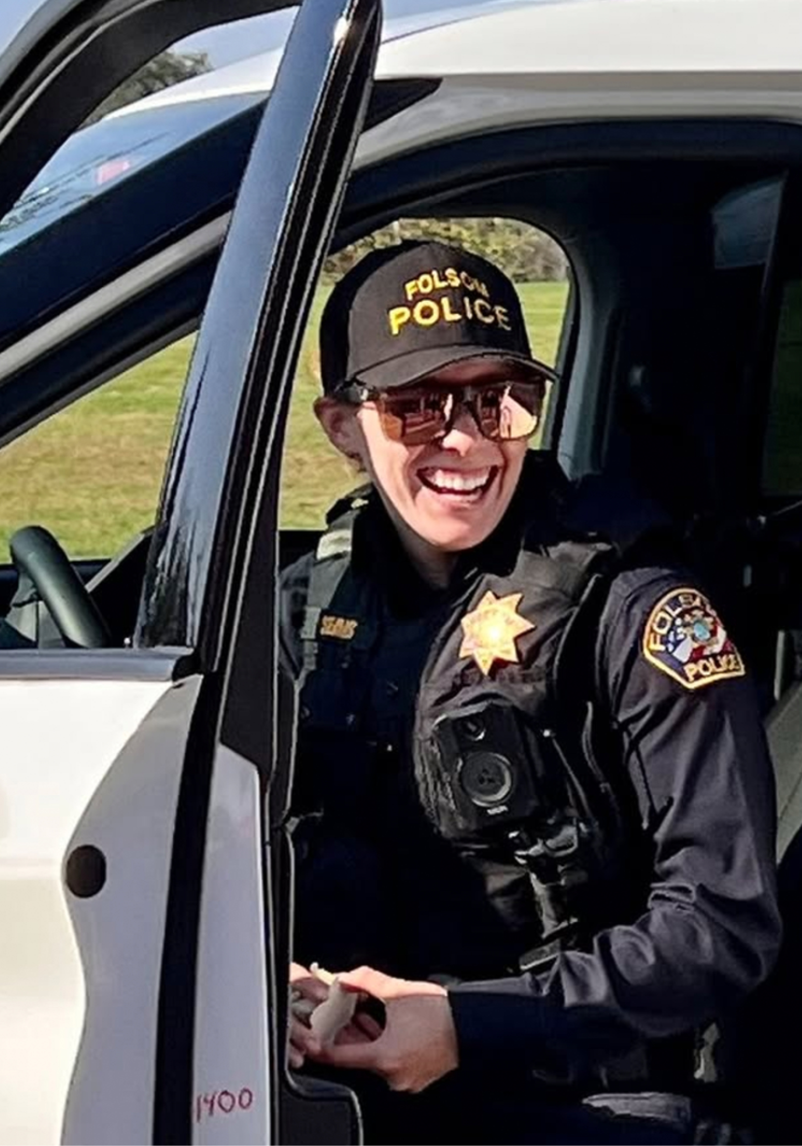 a police officer sitting in her vehicle cropped for mobile