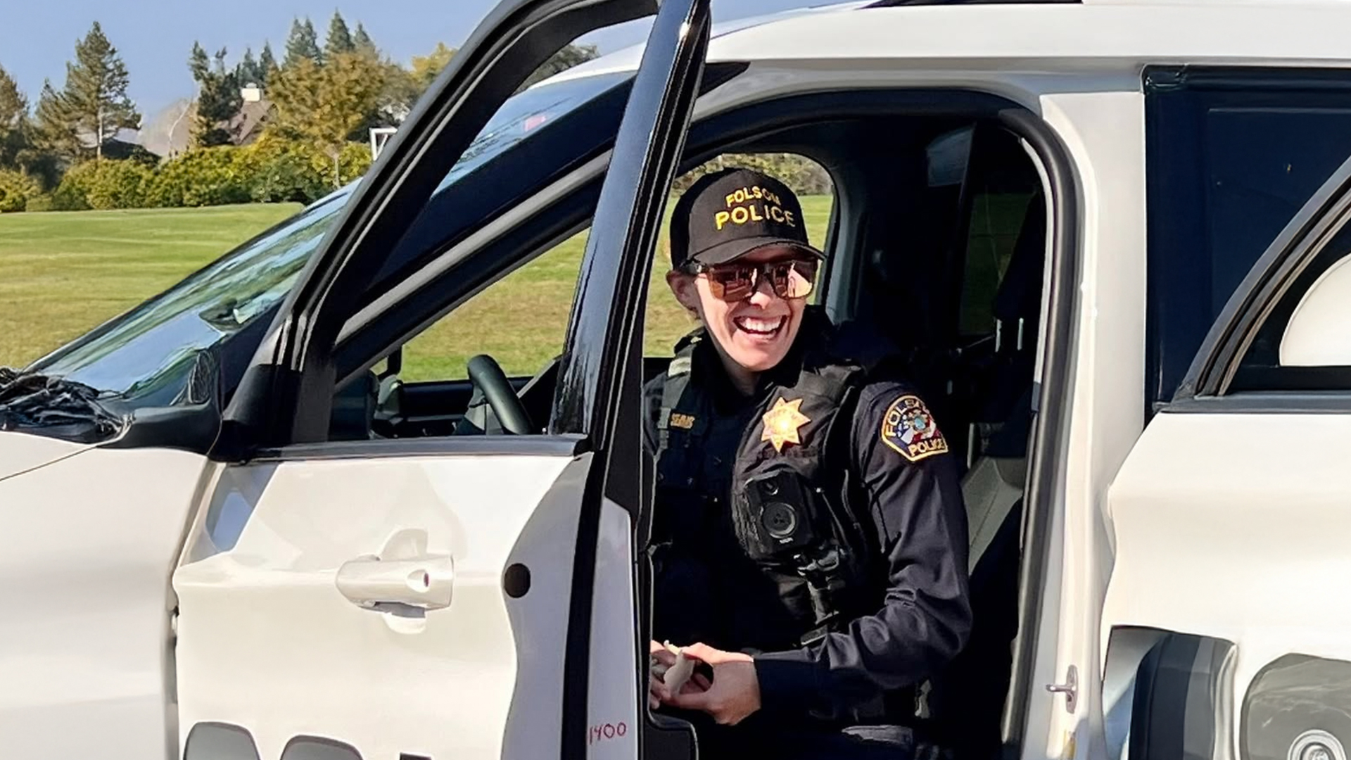 a police officer sitting in her vehicle